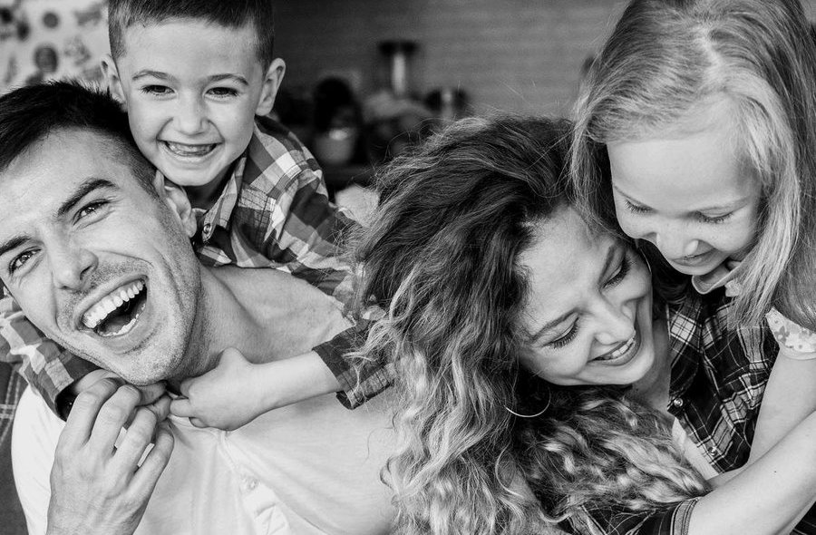 A family laughing together at home