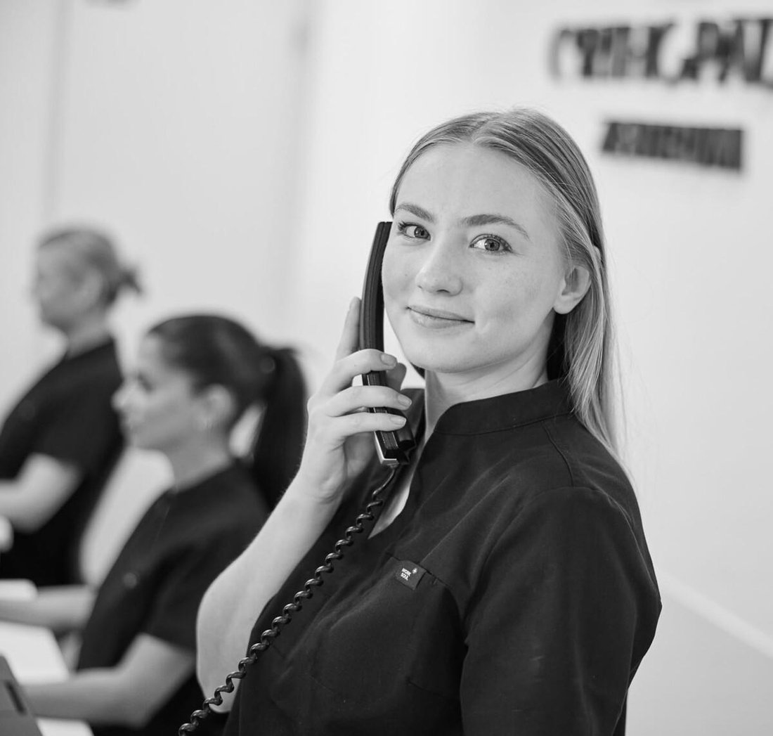 A front-desk team member on the phone